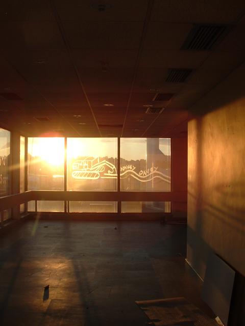 Meridian studios, Sunset through a graffitid window.jpg